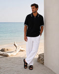 POPCORN KNIT HALF ZIP BLACK POLO – textured black knit with white tipping and half-zip placket